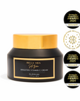 Black jar of Bella Vida Brighten Vitamin C Cream with gold lid on a white background, featuring multiple awards.