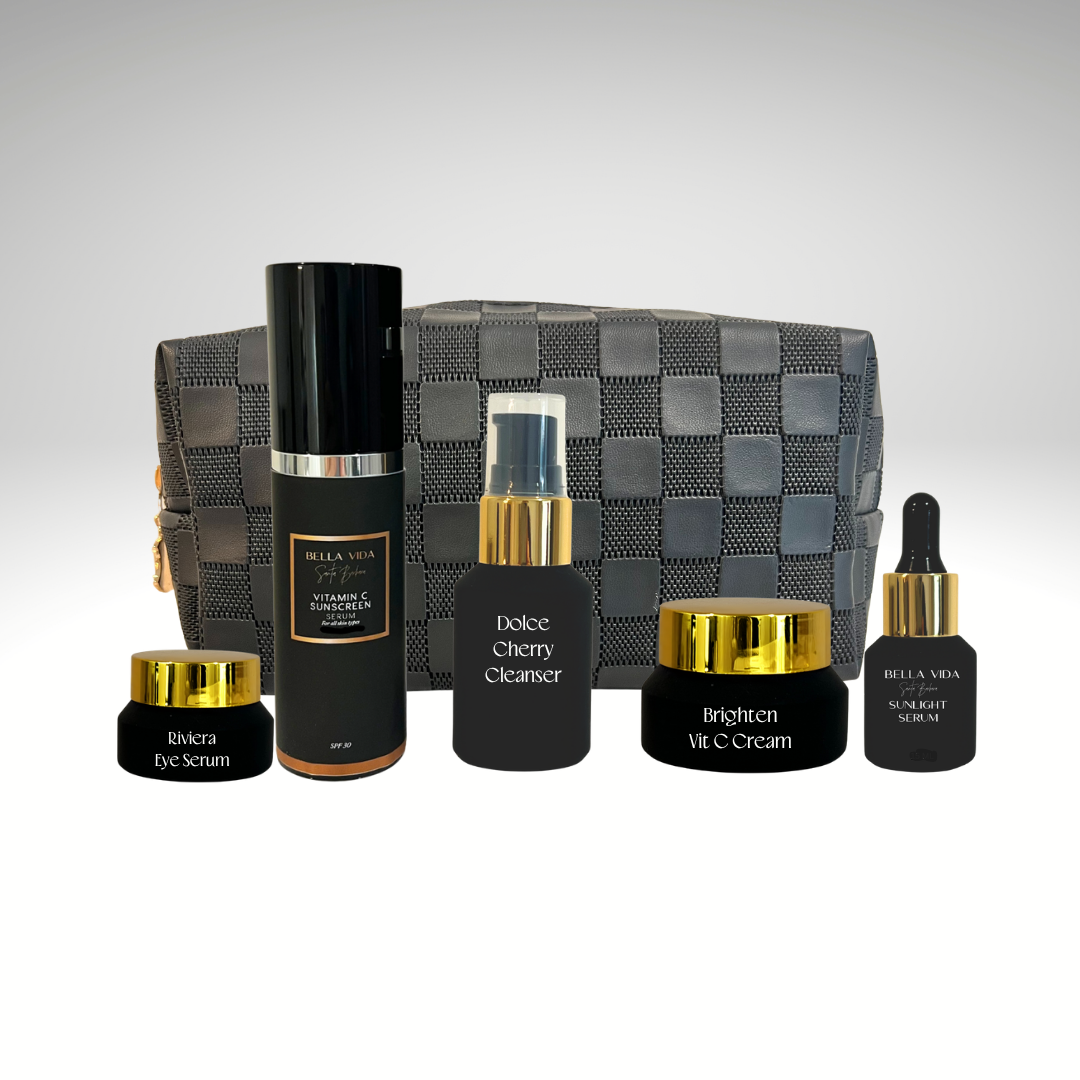 Set of Bella Vida skincare products with a gray checkered bag on a gradient background